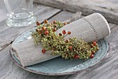Napkin in wreaths of seeds of fennel (Foeniculum)