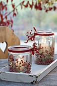 Preserving jars as glass in glass. Wind lights with pink