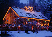 Christmas lights on house and garden fence