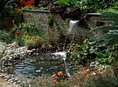 Waterfall flows into small pond