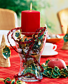 Christmas table decoration with Ilex leaves (holly)