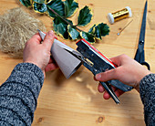 Christmas name tag: Shape cardboard into bags and staple in place