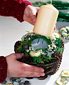 Candle decoration with pine cones - push the candle into the floral foam - in compound