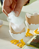 Sow cress in eggshell, fill the eggshells with cotton wool