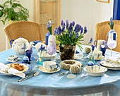 Easter table decoration with grape hyacinths