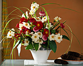 Bouquet of white and red dahlias, grasses, hostas