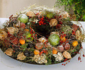 Fruit wreath with sugared fruits: Lime, kumquait, lychee, physalis