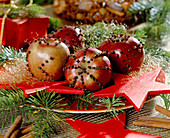 Decorate apples with cloves