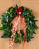Door wreath decorated with Laurus nobilis (laurel)