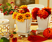 Small clay vases with autumn chrysanthemums as table decoration