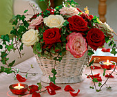 Basket with roses, hydrangea (hydrangea), hedera (ivy)