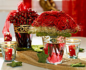 Bouquet of red roses with gold glitter, moss star, angel hair, rose rosehips