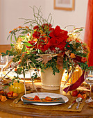 Autumnal arrangement with Hippeastrum (Amaryllis), Hydrangea (Hydrangea), Boxwood