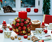 Table decoration with apples - apples stuck on sticks and in floral foam