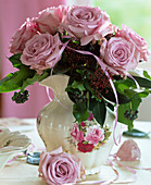 Pink roses, Skimmia, Hedera (ivy) with berries