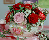 Bouquet with red and pink roses, Viburnum tinus (snowball)
