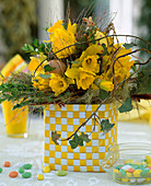 Easter bouquet with Narcissus (daffodils), Hedera (ivy vines)