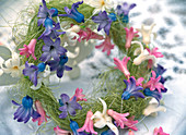 Hyacinth blossoms strung on silver wire and placed on a sisal wreath