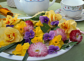 Spring flowers in a bowl as table decoration