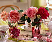 Rose blossoms in glasses with rose motifs