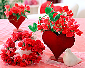 Wire heart and heart vase with Lathyrus odoratus (sweet pea)