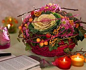 Arrangement of ornamental cabbage, chrysanthemum, ornamental apple, ivy and sea buckthorn