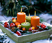 Candles, balls, Physalis (lampion flower), Pinus strobus (silk pine), Rosa (rosehip)