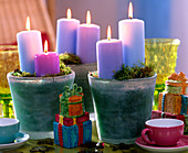 Jars filled with moss as candlesticks, gifts and glasses