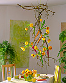 Sambucus (elder branches), Tulipa 'Ad Rem' (tulips) suspended from the ceiling