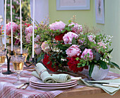 Table arrangement of: Paeonia (peonies), Convallaria