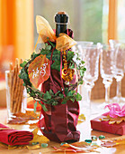Prosecco bottle with Hedera (ivy vine) and Hamamelis (witch hazel leaf) as a gift