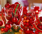 Glass with decorative apples and Christmas apples