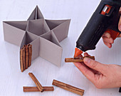 Cinnamon star: stick cinnamon sticks onto cardboard star with hot glue