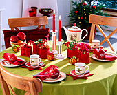 Christmas table decoration, with apples, oranges, felt bags