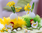 Goose eggs in feather nests as vases