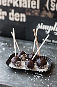 Chocolate cake pops with coconut flakes
