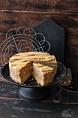 Vegan 'Engadiner Nusstorte' (Swiss walnut cake), with a slice cut out