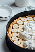 Unbaked banana cake in a baking tin