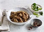 Rendang (Indonesian beef curry) with lemon leaves