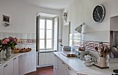 Ornamental tiled frieze in old-fashioned kitchen