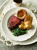 Sunday lunch with beef, Yorkshire pudding and roast potatoes (England)