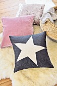 A star cushion on a sheepskin rug