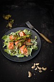 Caesar salad with crisp algae bacon and salmon