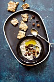 Hummus with black chickpeas and sesame seeds