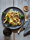 Char with an artichoke crust on a bed of apple sauerkraut (low carb)