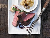 Venison steak with spiced pears