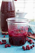 Preserved lingonberries in a jar