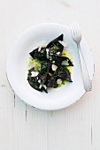 Mushroom ravioli with mussels, Parmesan and chives