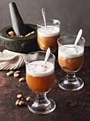 Wintry baked apple punch with roasted almonds and cream