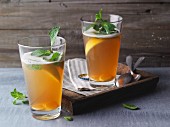 Tea and beer spritzer with non-alcoholic ginger beer